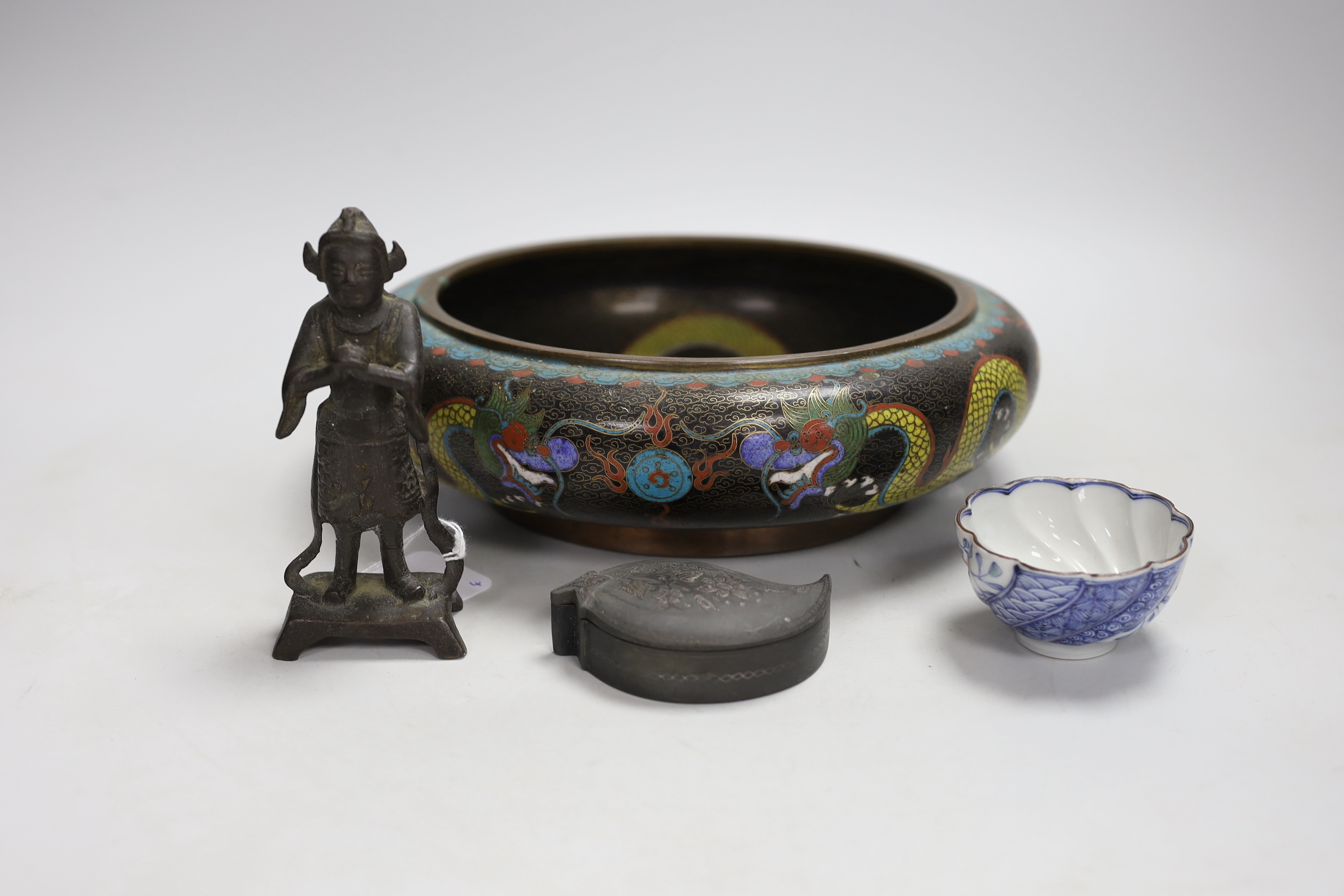 A Chinese cloisonné enamel bowl, a Japanese porcelain tea bowl, an Islamic white metal inlaid pewter box and a bronze figure